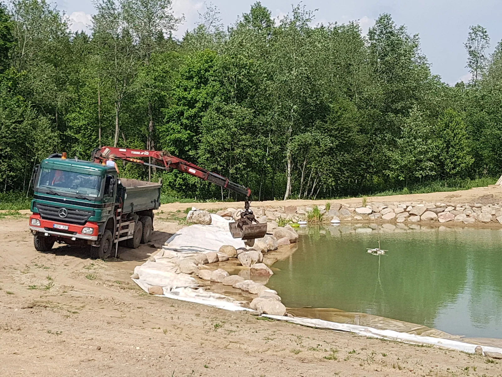 Medžiagų perkėlimas prie vandens telkinio